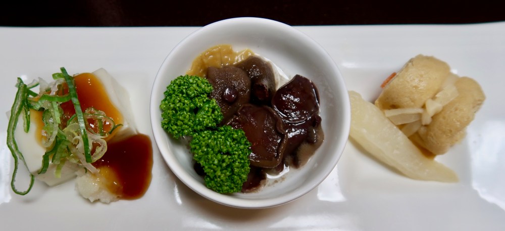 Starters of tofu, mushrooms and fish wrapped in soaked bread