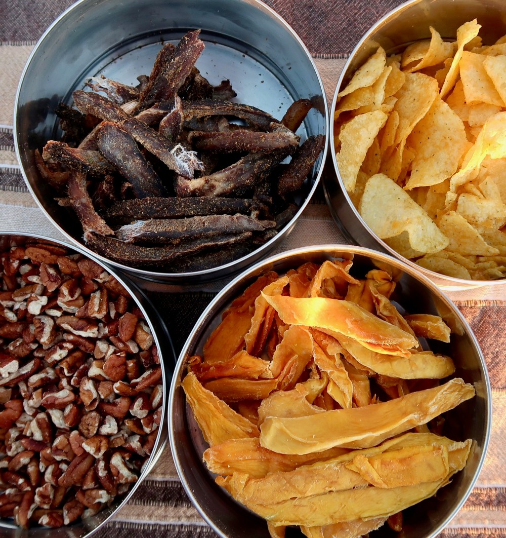 Sundowner snacks - biltong, crisps, pecan nuts and dried mango.